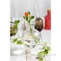Mini jarrón de vidrio acanalado transparente para flores cortas